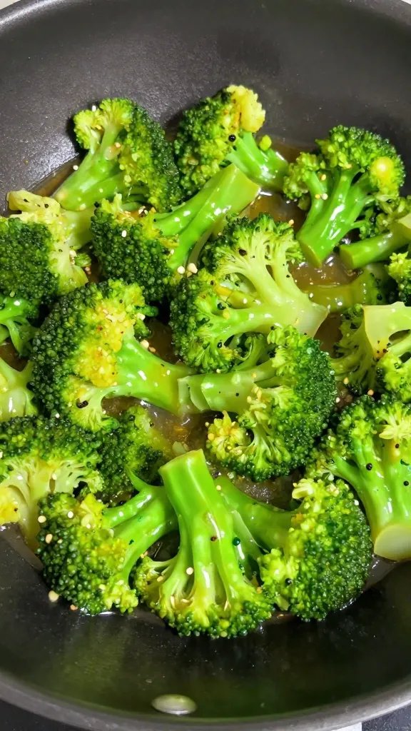 [RECIPE 1] broccoli florets glistening in wok glaze, shallow depth